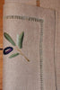 Serviette aus Leinen mit handgsticktem Olivenzweig und Hohlsaum